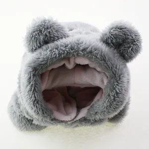 Detail of the cozy pink fleece lining inside a grey plush pet hooded sweater for dogs