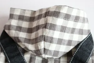 Detailed close-up showing the precise stitching on a plaid pet dog hoodie denim jumpsuit