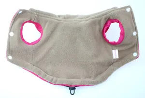 Detail view of warm brown polar fleece lining and snap buttons on pink pet jacket