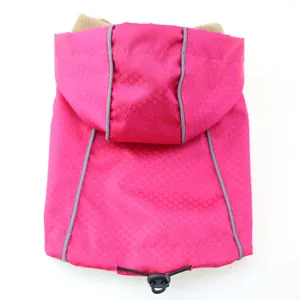 Detail of pink waterproof dog windbreaker with honeycomb pattern and warm fleece lining.