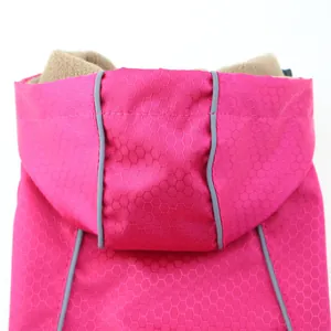 Detail of pink waterproof dog windbreaker with fleece lining and reflective strips