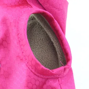 Macro detail of waterproof honeycomb fabric and warm fleece lining of pet jacket