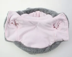 Detailed view of the soft pink fleece lining of a pet winter jacket