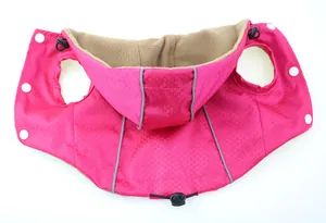 Detailed view of pink waterproof dog jacket with warm fleece lining and reflective strips