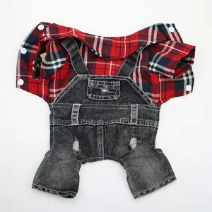 Macro detail view of red plaid shirt and distressed black denim overalls for pet dogs.