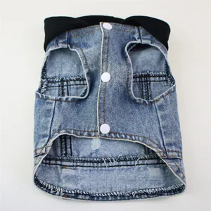 Detailed close-up view of a blue denim hooded pet vest featuring white snap buttons