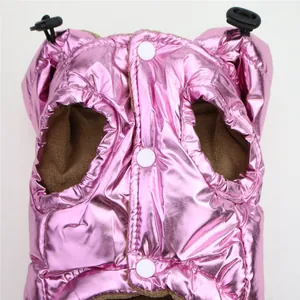 Detailed view of metallic pink pet winter vest featuring white snaps and fleece lining