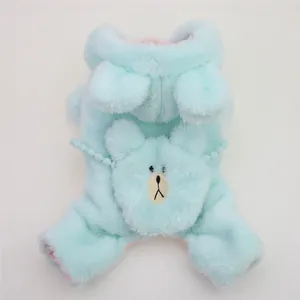 Detailed view of plush mint green dog winter jumpsuit with cute bear applique.