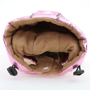 Detailed close-up showing the thick tan fleece lining of a pink metallic pet hooded vest