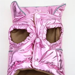 Detail view of a pink metallic pet puffer vest with warm fleece lining and buttons.
