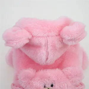 Close-up of soft pink plush dog hoodie featuring cute 3D bear ears on the hood