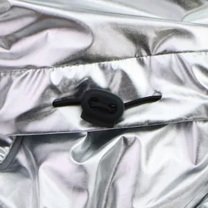 Macro detail of silver metallic pet winter jacket with black adjustable toggle cord