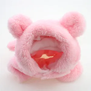 Detail of soft pink plush dog hoodie jumpsuit with cute bear ears for winter warmth.