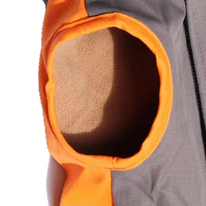 Detail of waterproof large dog jacket showing warm fleece lining and orange trim.
