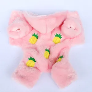 Close-up of pink plush pet hoodie with embroidered pineapple patterns for winter