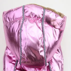 Close-up detail of a shiny pink metallic hooded dog vest with warm fleece lining.