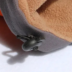 Close-up detail showing adjustable drawstring toggle and soft fleece lining on dog jacket