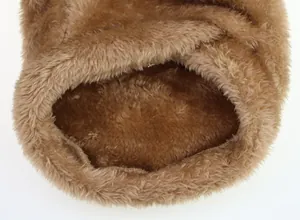 Close-up macro detail of soft brown plush fabric on small dog autumn winter clothing