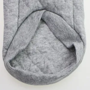 Macro view showing the soft grey quilted fabric and durable stitching of a dog sweatshirt
