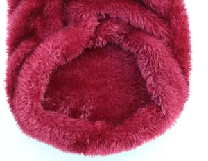Close-up of soft plush fabric and collar detail on a burgundy pet dog vest
