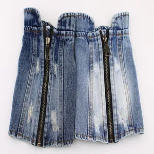 Close-up of ripped denim pet vest with heavy-duty zipper for small dogs and bulldogs