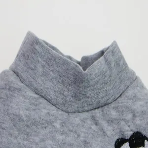 Macro view of the elastic high-collar on a grey autumn winter small dog knit T-shirt