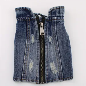 Macro view of distressed denim dog vest featuring high-quality front zipper and rip details