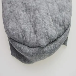 Detailed close-up of grey textured fleece fabric on a small dog t-shirt for winter
