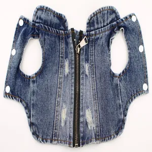 Detailed view of blue distressed denim pet vest with zipper and snap buttons