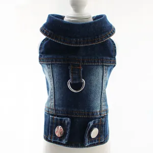 Detail view of a classic blue denim pet vest featuring a sturdy metal D-ring and buttons