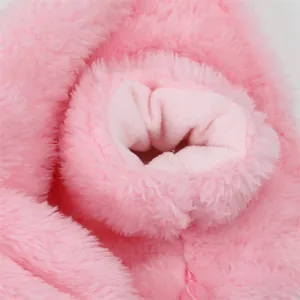 Close-up view of the soft pink fleece texture and ribbed cuff of the pet winter coat.
