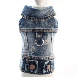 Detailed view of blue denim pet vest with leash attachment and distressed fabric