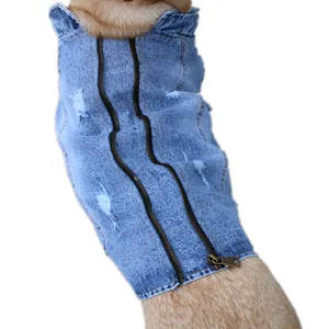 Close-up of blue distressed dog denim vest with dual zipper design and ripped details
