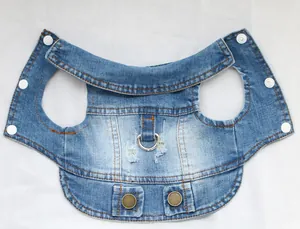 Detailed macro view of blue denim pet vest harness featuring a sturdy metal D-ring