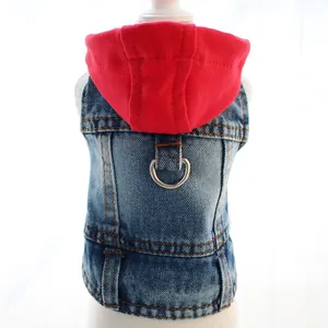 Detail of pet denim vest with red hoodie and metal D-ring attachment for small dogs