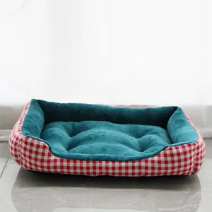 Cozy red plaid rectangular pet bed with soft teal plush interior for small dogs and cats