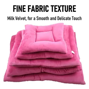 Stack of soft pink milk velvet pet mats showing thick padding for winter warmth