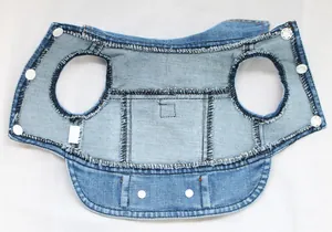 High quality detail view showing inner lining of denim pet vest with white snap buttons