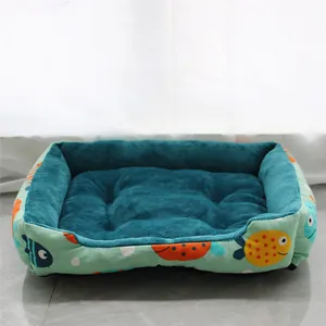 Cozy soft plush pet bed featuring a colorful fish pattern and deep teal fleece interior