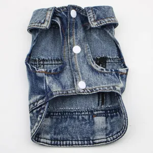 Close-up of blue denim pet vest with white buttons for small dogs and puppies.