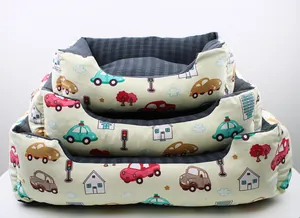 Three stacked pet beds with cartoon car patterns in different sizes for dogs and cats