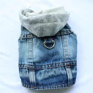 Detail view of pet denim vest featuring a sturdy metal D-ring for leash attachment.
