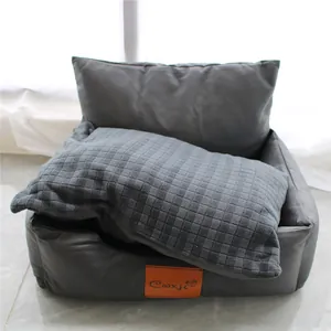 Close-up of grey pet sofa bed featuring soft quilted cushion and Coxji brand label