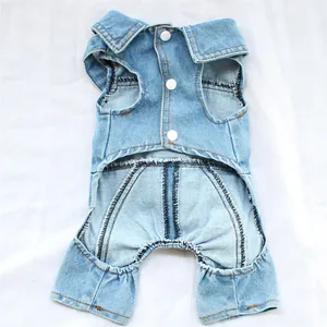 Detailed view of blue denim pet dog jumpsuit with white snap buttons and collar