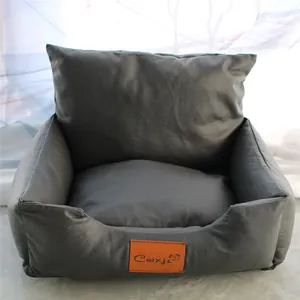 Detailed macro view of a grey faux leather pet sofa bed for small dogs and cats