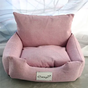 Detailed close-up of a pink linen-textured pet sofa bed featuring a soft plush cushion