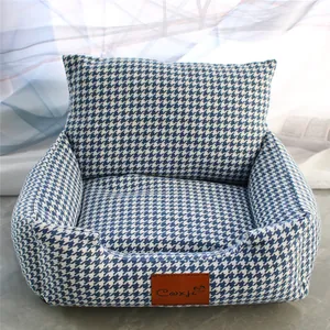 Detailed view of the blue and white houndstooth pattern on a plush dog sofa bed