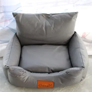 Close-up of a premium gray faux leather pet sofa bed featuring a durable brand patch