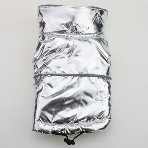 Close-up of silver metallic pet puffer vest showing reflective strip and drawstring.