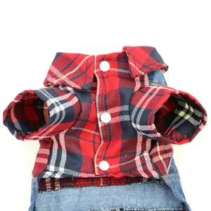 Close-up detail of red plaid and denim pet dog jumpsuit with white snap buttons